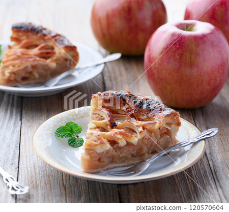 Apple pie (cut image) on old wooden background Apple pie (cut image) on old wooden background 120570604