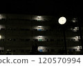 Apartment complex and clock at night 120570994
