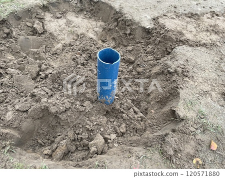 Construction team digging a fresh water well 120571880