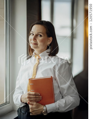 Creating a Productive Study Environment at Home, women's hands with a notebook and pen at the table 120571950