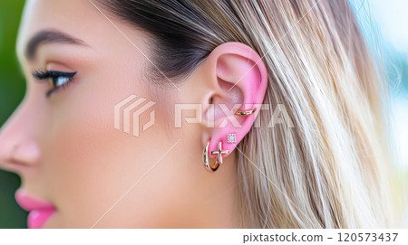 Color coordinated piercings with matching jewelry enhance elegant look. stylish accessories complement hair and skin tone beautifully, creating chic appearance 120573437