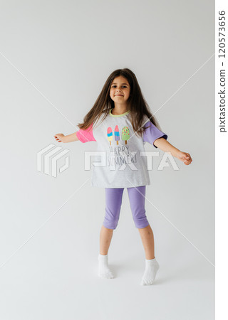 Cute girl 4-5 year old posing in studio 120573656