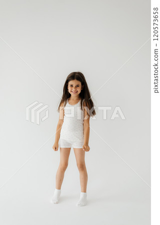 Cute girl 4-5 year old posing in studio Cute girl 4-5 year old posing in studio 120573658