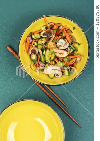 Spicy squid salad with mix vegetables. 120575580