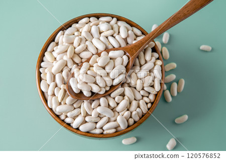 Kidney beans in a wooden bowl over pastel mint background. Kidney beans in a wooden bowl over pastel mint background. 120576852