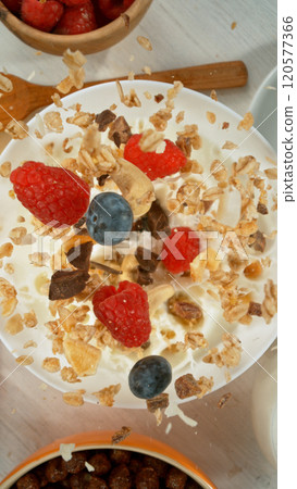 Freeze motion of flying group of cereal breakfast mix. Healthy eating and diet concept. Freeze motion of flying group of cereal breakfast mix. Healthy eating and diet concept. 120577366