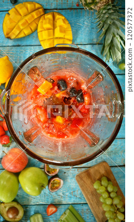 Fresh fruit and vegetables smoothie blended in blender, top view. Healthy eating concept. Freeze motion. Fresh fruit and vegetables smoothie blended in blender, top view. Healthy eating concept. Freeze motion. 120577372