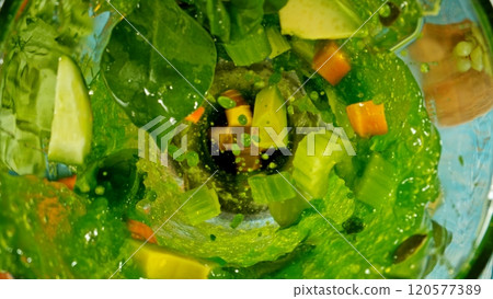 Fresh fruit and vegetables smoothie blended in blender, top view. Healthy eating concept. Freeze motion. Fresh fruit and vegetables smoothie blended in blender, top view. Healthy eating concept. Freeze motion. 120577389