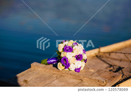 beautiful bouquet on a background of water.Wedding bouquet by the lake 120578089