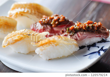 engawa sushi and gyuuniku sushi , rice topped with fish or Japanese food engawa sushi and gyuuniku sushi , rice topped with fish or Japanese food 120579214