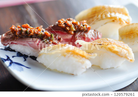 engawa sushi and gyuuniku sushi , rice topped with fish or Japanese food 120579261