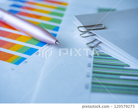Graphs and documents on the table Graphs and documents on the table 120579273