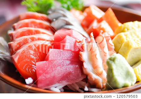sashimi or raw salmon , Akami and raw tuna or raw mackerel and kanikamaand wasabi or raw fish 120579503