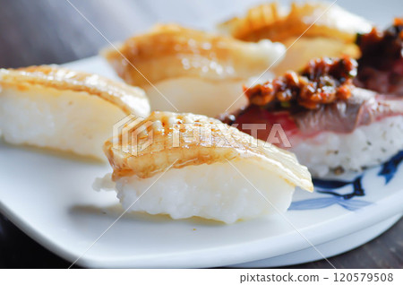 engawa sushi and gyuuniku sushi , rice topped with fish or Japanese food engawa sushi and gyuuniku sushi , rice topped with fish or Japanese food 120579508