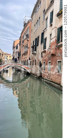 Venetian narrow canals with old historic buildings. Venetian narrow canals with old historic buildings. 120579981