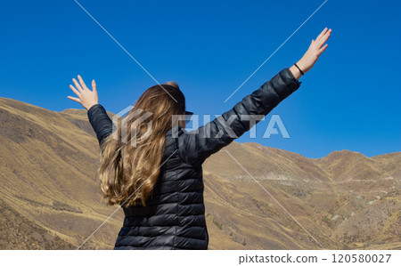 Blonde haired tourist woman enjoying the scenery of Northern Argentina. Blonde haired tourist woman enjoying the scenery of Northern Argentina. 120580027