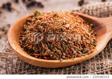 Dry Rub Spice on a Vintage Spoon,wooden table Dry Rub Spice on a Vintage Spoon,wooden table 120580333
