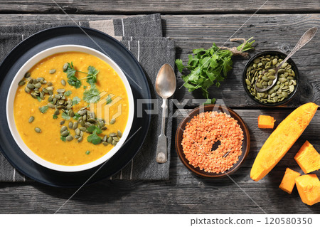 Pumpkin Red Lentil Soup in white bowl, top view Pumpkin Red Lentil Soup in white bowl, top view 120580350