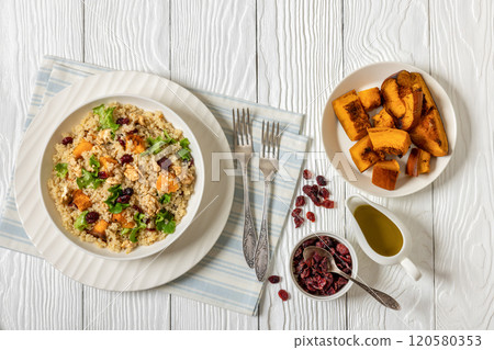quinoa pumpkin salad in a bowl, top view 120580353