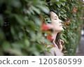 Woman buried in plants 120580599