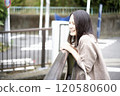 Women chatting on a bridge 120580600