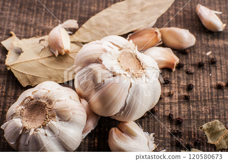 garlic on wooden surface garlic on wooden surface 120580673