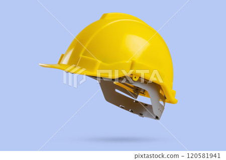 Yellow safety construction helmet on blue background Yellow safety construction helmet on blue background 120581941