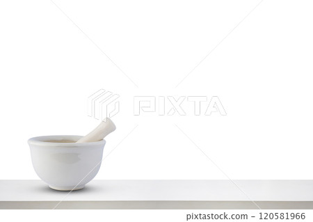 Mortar and pestle on white wooden table top isolated on white background pharmacy concept Mortar and pestle on white wooden table top isolated on white background pharmacy concept 120581966
