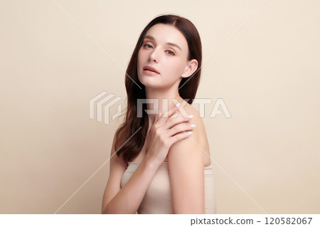 Beautiful young woman with clean fresh skin on beige background, Face care, Facial treatment, Cosmetology, beauty and spa, women portrait. 120582067