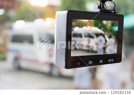Car CCTV camera video recorder with ambulance car on the road 120582130