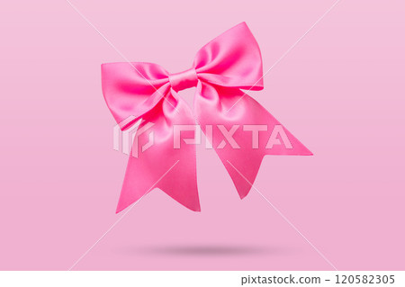 pink gift bow isolated on pink background 120582305