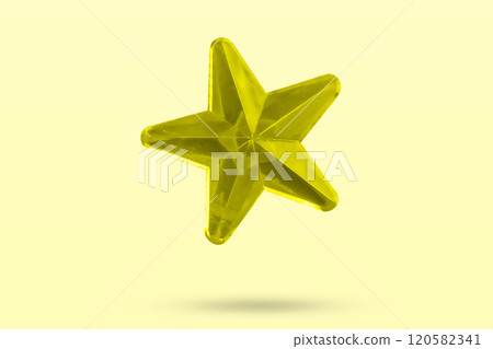 golden Christmas star jewels sticker isolated on yellow background 120582341