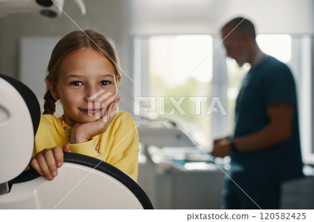 Portrait of Young Girl Leaning on Medical Equipment Portrait of Young Girl Leaning on Medical Equipment 120582425