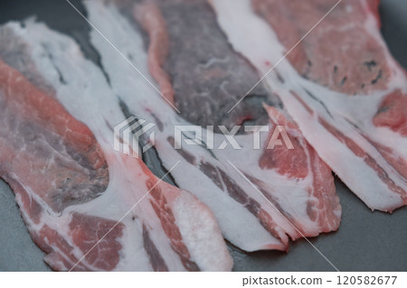 Grilling pork on a hot plate (stock photo) Grilling pork on a hot plate (stock photo) 120582677