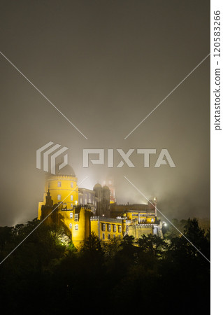 Illuminated Pena Palace in Sintra at Night. Portugal. Clouds, Fog 120583266