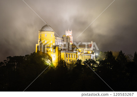 Illuminated Pena Palace in Sintra at Night. Portugal. Clouds, Fog 120583267
