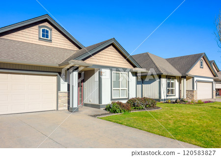 Row of nice residential houses on bright winter day in British Columbia, Canada 120583827