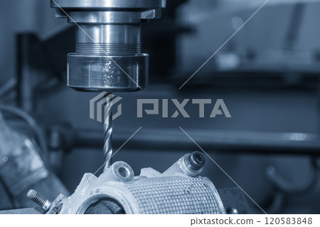 The hole drilling process on NC milling machine with automotive parts. The hole drilling process on NC milling machine with automotive parts. 120583848