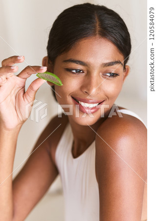 Natural Beauty Smiling Woman Holding Aloe Vera Skincare Concept Natural Beauty Smiling Woman Holding Aloe Vera Skincare Concept 120584079