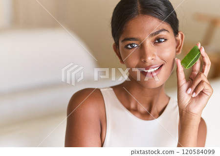 Skin Care. Woman Holding Fresh Aloe Vera for Natural Skincare Solution Skin Care. Woman Holding Fresh Aloe Vera for Natural Skincare Solution 120584099