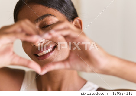 Dental Care. Smiling Woman Framing Face with Hands in Heart Shape Gesture 120584115