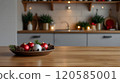 Kitchen blurred background with an empty wooden table or counter, Christmas decorations, and lights, selective focus, for product presentation. 120585001
