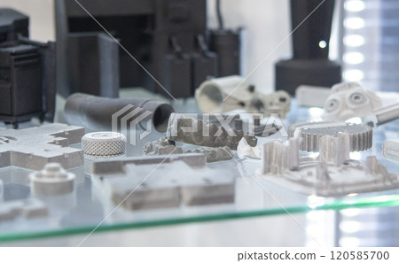 Different object printed on a 3D printer from molten plastic powder. Different model printed on 3D printer from melted black polyamide powder. New additive 3D printing Multi Jet Fusion MJF technology 120585700