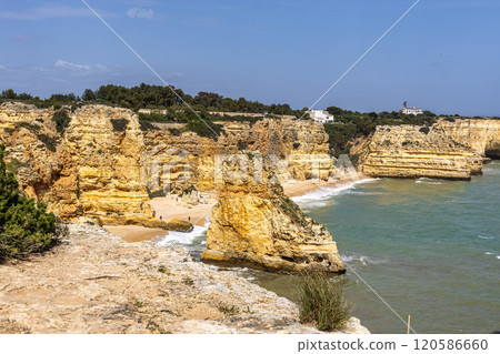 Praia da Marinha Beach among rock islets and cliffs seen from Seven Hanging Valleys Trail, Algarve, Portugal 120586660
