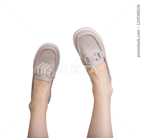 Feet in stylish leather loafers, a trendy and comfortable pair of slip on shoes. Modern, casual Feet in stylish leather loafers, a trendy and comfortable pair of slip on shoes. Modern, casual 120588026