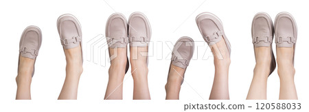 Feet in elegant beige loafers, slip on leather footwear. Classic, trendy footgear for casual or 120588033