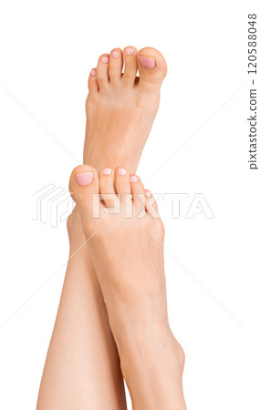 Barefoot foot with relaxed, elegant posture, showcasing healthy skin and nail care. Female model Barefoot foot with relaxed, elegant posture, showcasing healthy skin and nail care. Female model 120588048