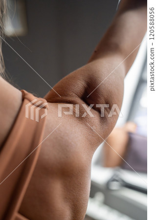 Pilates fitness trainer beautiful back relief. Pilates studio. Young sporty attractive woman wearing sportswear in yoga studio. Fit, healthy and strong authentical body. Fitness concept 120588056