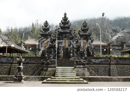 The large sacred traditional temple of Pura Pasar Agung Sebudi on the mountain after the ash eruption at Mount Agung on the popular tourist island of Bali. The large sacred traditional temple of Pura Pasar Agung Sebudi on the mountain after the ash eruption at Mount Agung on the popular tourist island of Bali. 120588217