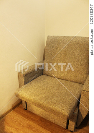 An armchair in the corner of the room. Interior in the room 120588347